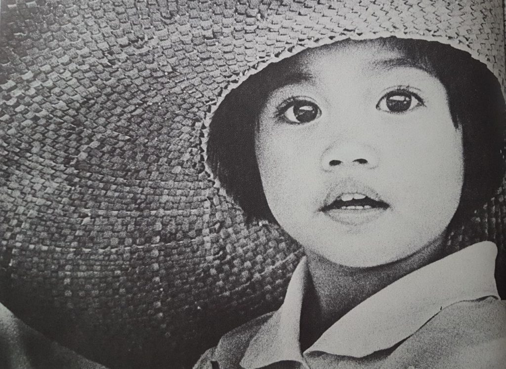 Girl in hat - photographer unknown